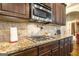 Granite countertop kitchen with gas cooktop at 1145 Eagles Brooke Dr, Locust Grove, GA 30248