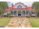 Community clubhouse with stone pathway and red roof at 80 Rosemoore Dr, Covington, GA 30014