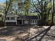 Brick ranch house with carport and mature trees at 2523 Lake Jodeco Rd, Jonesboro, GA 30236