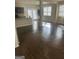 Open kitchen with dark cabinets and hardwood floors at 1080 Lear Dr, Locust Grove, GA 30248