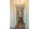 Entryway with wood-look flooring, chandelier, and closet at 1541 Paces Ferry North Se Dr, Smyrna, GA 30080