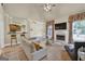 Living room with fireplace, large windows, and high ceilings at 12795 Wyngate, Alpharetta, GA 30005