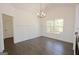 Bonus room with wainscoting, a chandelier, and large windows providing natural light at 3278 Greenhill Dr, Villa Rica, GA 30180