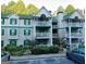 Two-story apartment building with balconies, surrounded by trees and shrubs at 3601 Shepherds Path, Decatur, GA 30034