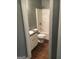 Bathroom featuring a shower-tub combo, toilet, and vanity at 160 Orchard Dr, Covington, GA 30014