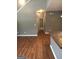 Hallway leading to other rooms with wood-style flooring at 160 Orchard Dr, Covington, GA 30014