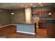 Spacious kitchen with island, modern lighting, and wood floors at 160 Orchard Dr, Covington, GA 30014