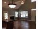 Living room with fireplace, vaulted ceilings, and natural light at 160 Orchard Dr, Covington, GA 30014