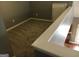 View of a carpeted loft overlooking the floor below at 160 Orchard Dr, Covington, GA 30014