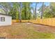 Fenced backyard with a wooden fence, providing privacy and space for outdoor activities at 10581 Eagles Dr, Jonesboro, GA 30238