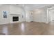 Large living room with fireplace, wood-look flooring and ample space at 215 Woodfield Ct, Mcdonough, GA 30253