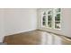 Bright bedroom featuring hardwood floors and large windows, offering plenty of natural light at 3920 Clifton Hill Ct, Cumming, GA 30040