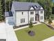 Elegant home boasts a well-manicured lawn and a spacious three-car garage at 3920 Clifton Hill Ct, Cumming, GA 30040