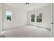 Bright, airy bedroom with natural light streaming in through the large windows at 3920 Clifton Hill Ct, Cumming, GA 30040