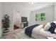 This bedroom features a large window and ensuite bathroom, offering a relaxing and private retreat at 3920 Clifton Hill Ct, Cumming, GA 30040