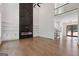 Modern living room with a soaring ceiling, a fireplace, and built-in shelving, offering style and functionality at 3920 Clifton Hill Ct, Cumming, GA 30040
