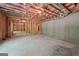 Unfinished basement space with exposed wooden framing, offering a blank canvas for customization at 3920 Clifton Hill Ct, Cumming, GA 30040