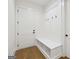 Bright mudroom featuring a built-in bench with storage and coat hooks at 3920 Clifton Hill Ct, Cumming, GA 30040