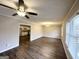 Bright dining room with wood-look flooring, ceiling fan and view into the kitchen at 2605 Glenvalley Dr, Decatur, GA 30032