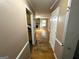 Hallway with hardwood floors leading to a living area at 4050 Sumit Wood Dr, Kennesaw, GA 30152