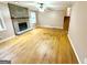 Living room with hardwood floors, stone fireplace and large windows at 4050 Sumit Wood Dr, Kennesaw, GA 30152