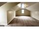 Bonus room with vaulted ceilings and carpeted flooring at 1091 Cherry Laurel Dr, Lithonia, GA 30058