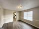 Dining room with wood-look flooring, chair rail molding, and a view to the kitchen at 1091 Cherry Laurel Dr, Lithonia, GA 30058