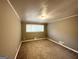 Empty bedroom with gray walls, carpeted flooring, and a window at 3102 W Peek Nw Rd, Atlanta, GA 30318