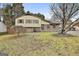 Front of a two-story home with landscaped yard at 6063 Cristie Dr, Ellenwood, GA 30294