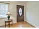 Home entryway with hardwood floors and decorative glass front door at 6063 Cristie Dr, Ellenwood, GA 30294