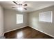 Spacious bedroom with hardwood floors, ceiling fan, and two large windows at 2830 Battle Forrest Dr, Decatur, GA 30034