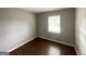Cozy bedroom with hardwood floors and a large window providing ample natural light at 2830 Battle Forrest Dr, Decatur, GA 30034