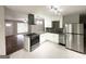 Modern kitchen with white cabinetry, stainless steel appliances, and a breakfast bar at 2830 Battle Forrest Dr, Decatur, GA 30034