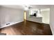 Open living area with hardwood floors, ceiling fan, and a view into the adjacent kitchen at 2830 Battle Forrest Dr, Decatur, GA 30034