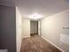 Finished basement area with neutral carpeting and recessed lighting at 1581 Mcclelland Ave, Atlanta, GA 30344