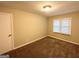 Cozy bedroom with neutral walls and plush carpeting at 1581 Mcclelland Ave, Atlanta, GA 30344