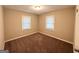 Bright bedroom with neutral walls, plush carpeting, and multiple windows at 1581 Mcclelland Ave, Atlanta, GA 30344