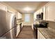Modern kitchen with white cabinets, stainless steel appliances, and granite counters at 1581 Mcclelland Ave, Atlanta, GA 30344