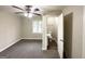 Spacious bedroom with plush carpet, ceiling fan, and an ensuite bathroom at 2003 Rosewood Rd, Decatur, GA 30032