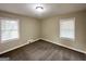 Bedroom with plush carpeting and several windows at 2003 Rosewood Rd, Decatur, GA 30032