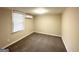 Additional bedroom with plush carpeting and a window at 2003 Rosewood Rd, Decatur, GA 30032