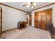 Bedroom with wooden furniture, carpeted floors and large closet at 401 Tenterden Curve, Peachtree City, GA 30269