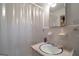 View of the bathroom with tile walls, a shower with curtain, and a vanity sink at 176 Craig Dr, Lawrenceville, GA 30046