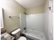 Clean bathroom with white tile, bathtub, toilet, and vanity at 464 Stonewood Dr, Stone Mountain, GA 30087