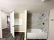 Bathroom with marble tiled shower, bathtub, and wood-look flooring at 464 Stonewood Dr, Stone Mountain, GA 30087
