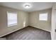 Spacious bedroom with carpeting and two large windows offering natural light at 464 Stonewood Dr, Stone Mountain, GA 30087