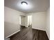 Open living area with neutral walls and wood-look flooring at 464 Stonewood Dr, Stone Mountain, GA 30087