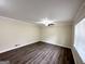 Bright living room with neutral walls, wood-look flooring, and a ceiling fan at 464 Stonewood Dr, Stone Mountain, GA 30087