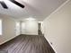 Spacious living room with ample natural light, wood-look flooring, and neutral paint at 464 Stonewood Dr, Stone Mountain, GA 30087