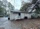 Backyard with a small deck and surrounding trees at 2353 Arno Ct, Atlanta, GA 30318